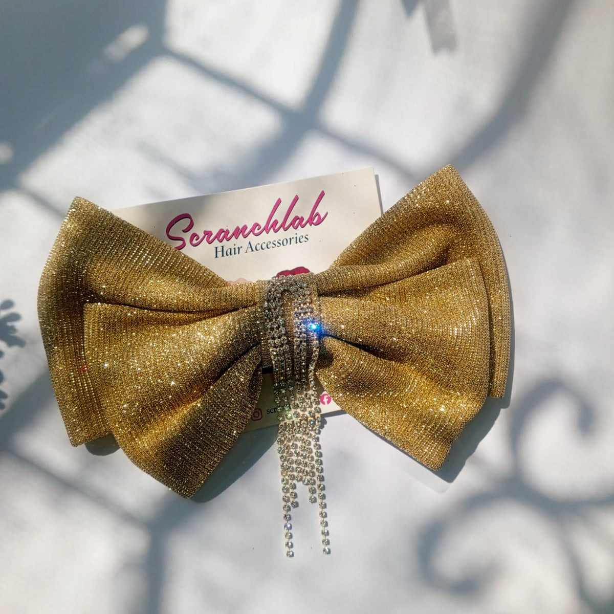 Scranchlab Aurora Gold Bow - crystal detail close up