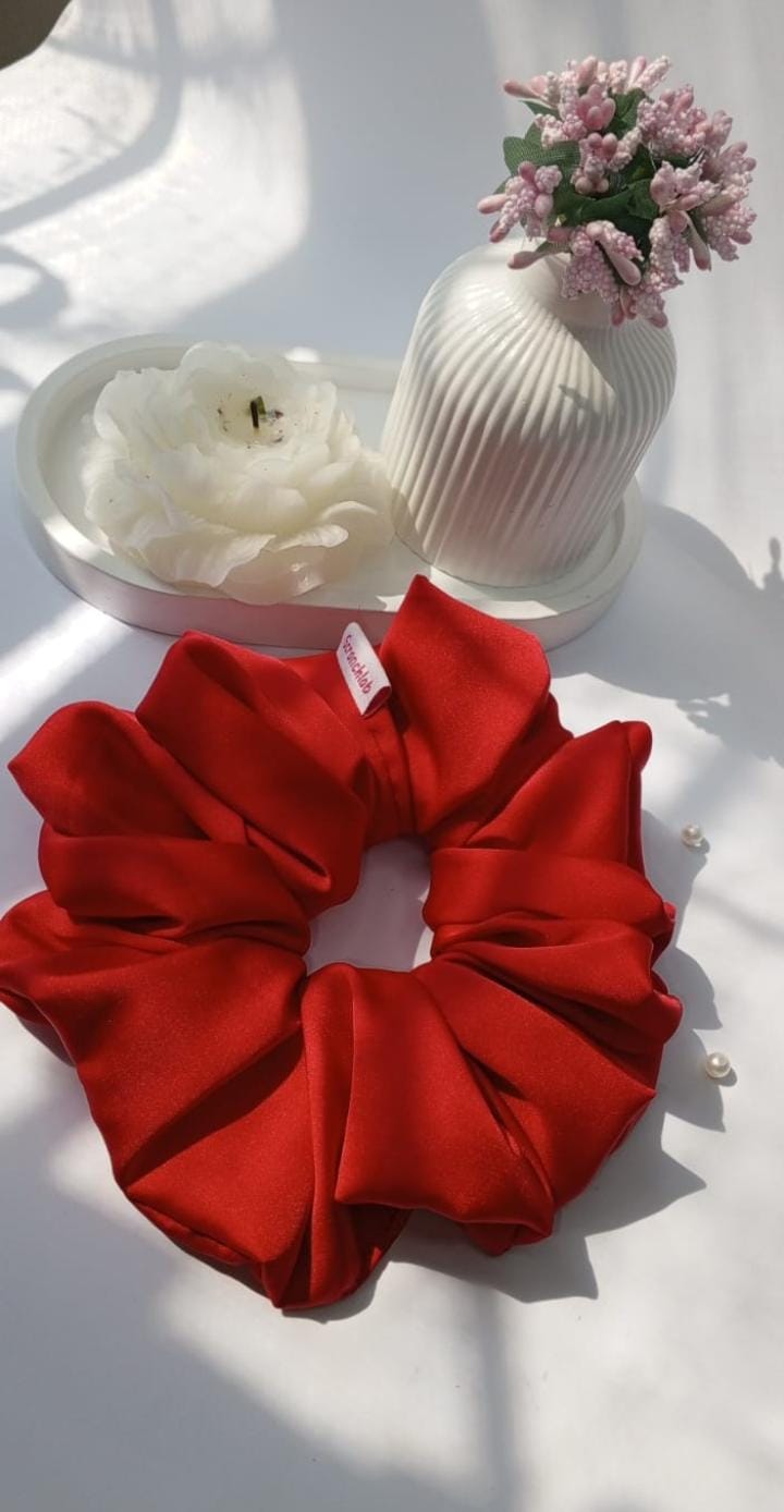 Scranchlab Cherry Red Silk Scrunchies on open book