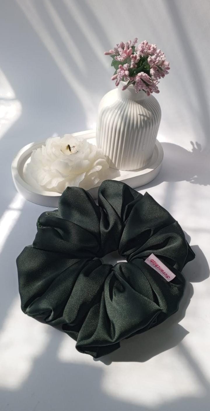 Scranchlab Midnight Green Silk Scrunchie - lifestyle flat lay with flowers