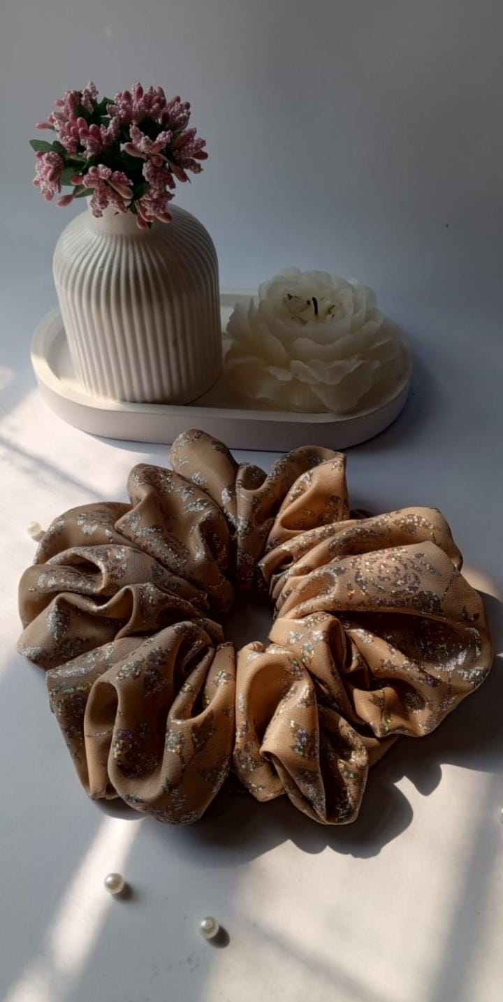 Scranchlab Muted Shimmer Silk Scrunchie - top view with pearls and vase
